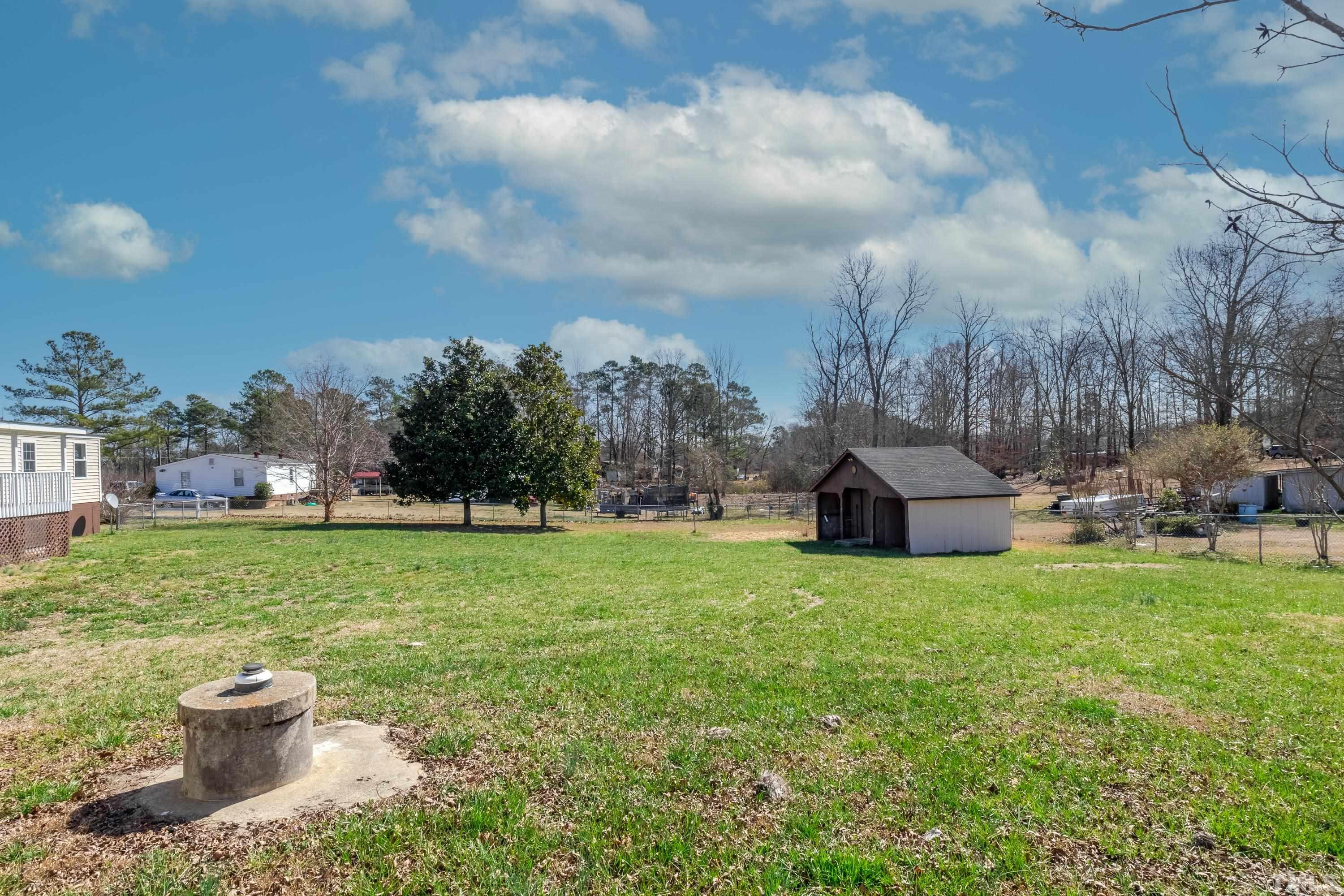 807 Lipscomb Road Angier, NC 27501 - Photo 8 of 39 a view of a garden with houses