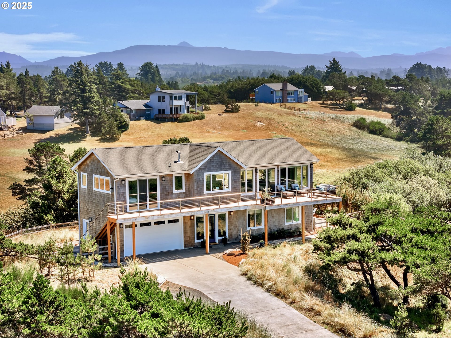 an aerial view of a house with a big yard