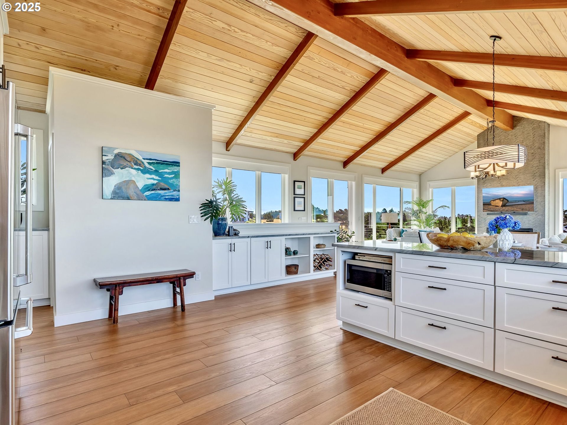 90043 Ocean Drive Warrenton, OR 97146 - Photo 25 of 48 a kitchen with a cabinets and wooden floor