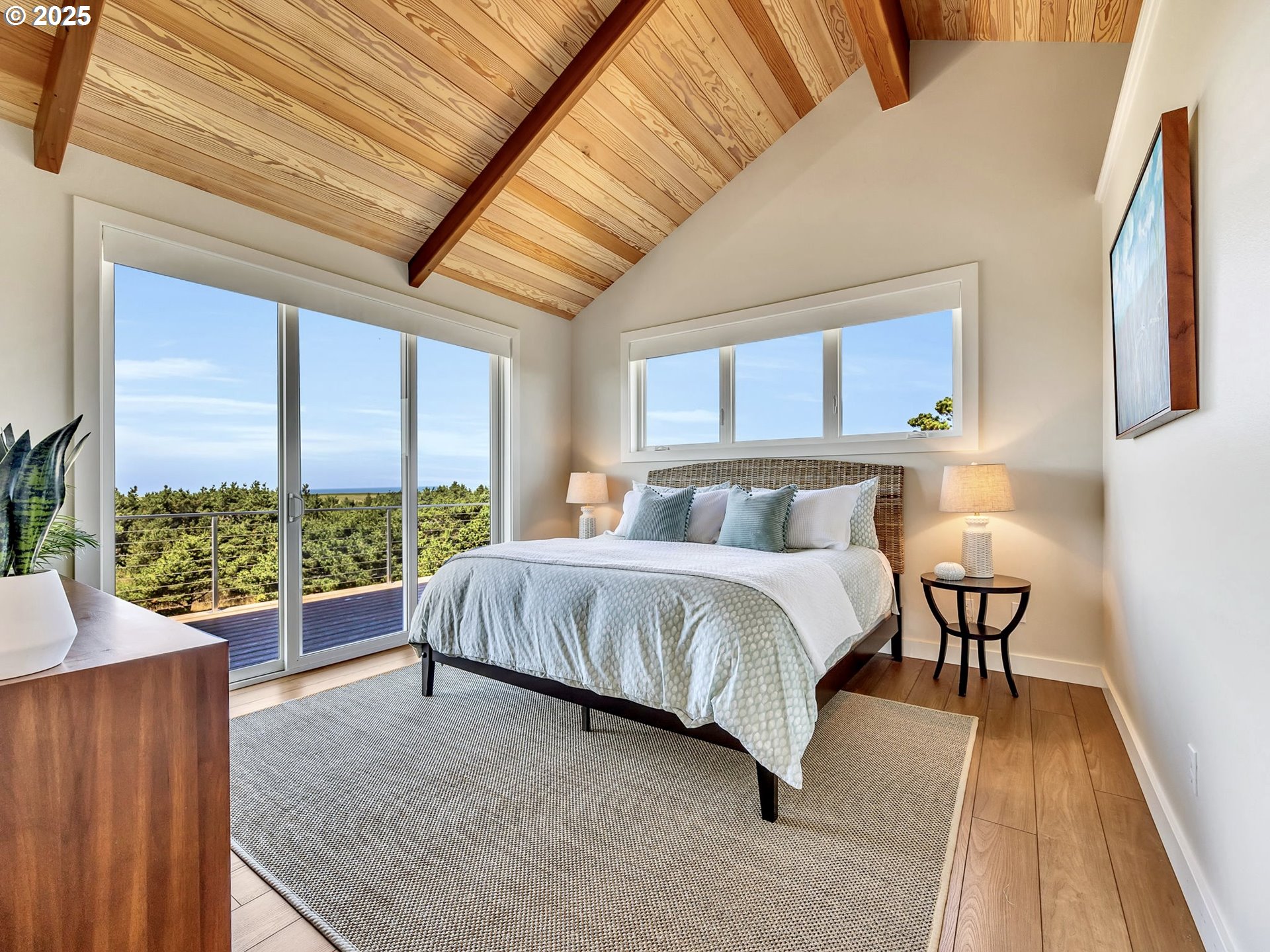 90043 Ocean Drive Warrenton, OR 97146 - Photo 27 of 48 a bed sitting in a spacious bedroom next to a window