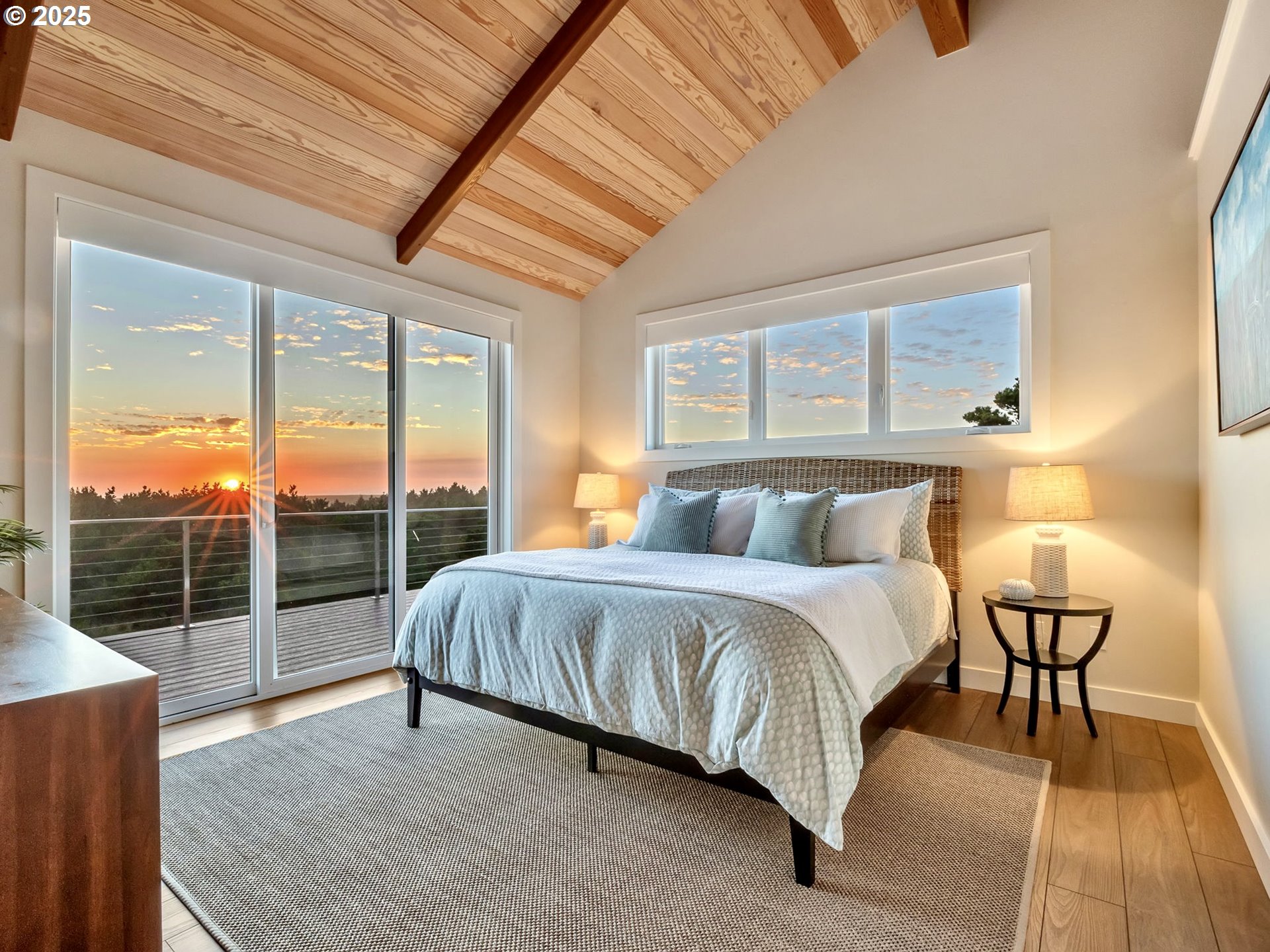 90043 Ocean Drive Warrenton, OR 97146 - Photo 29 of 48 a spacious bedroom with a bed and large window