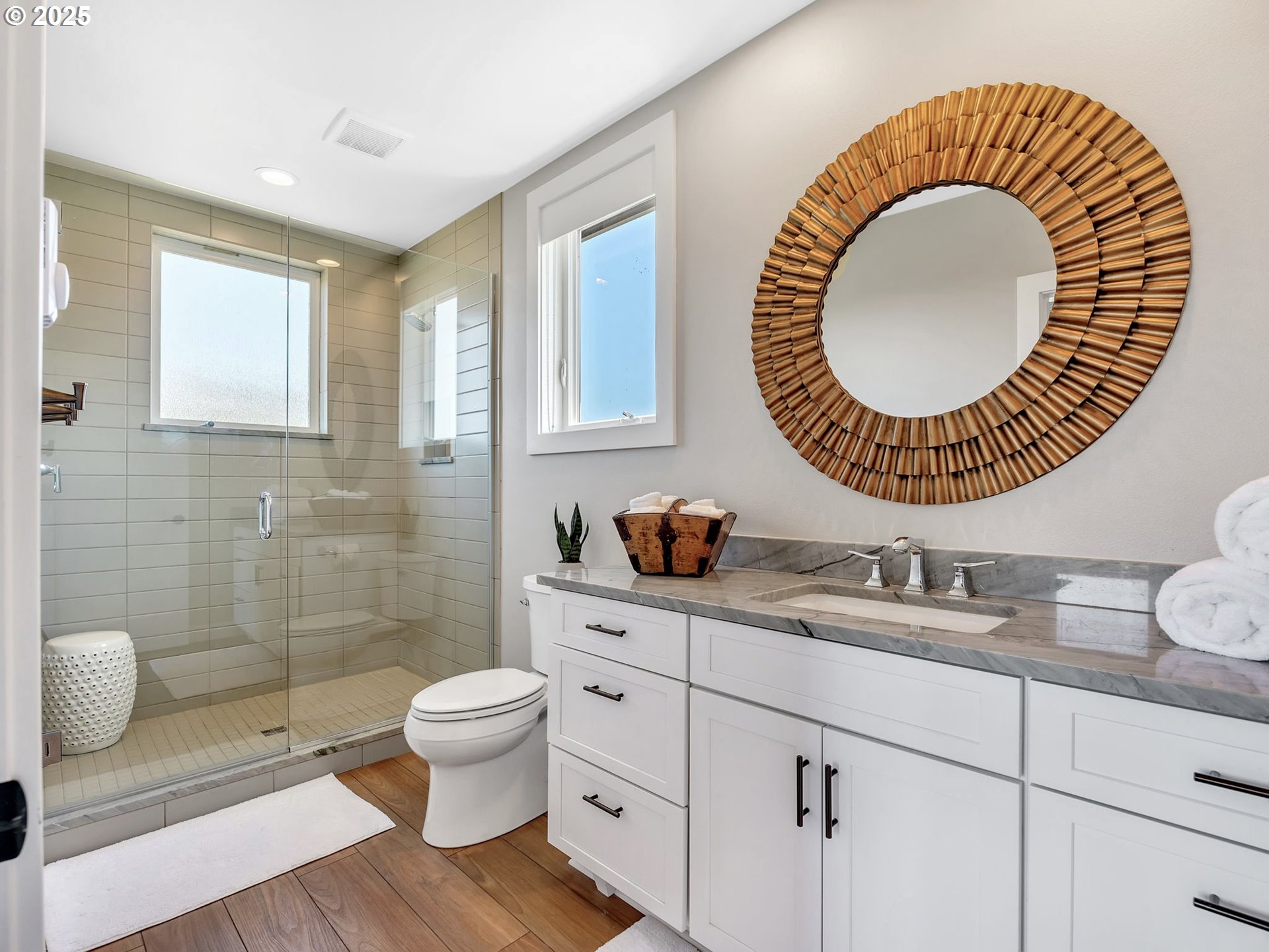 90043 Ocean Drive Warrenton, OR 97146 - Photo 30 of 48 a bathroom with a toilet a sink and mirror