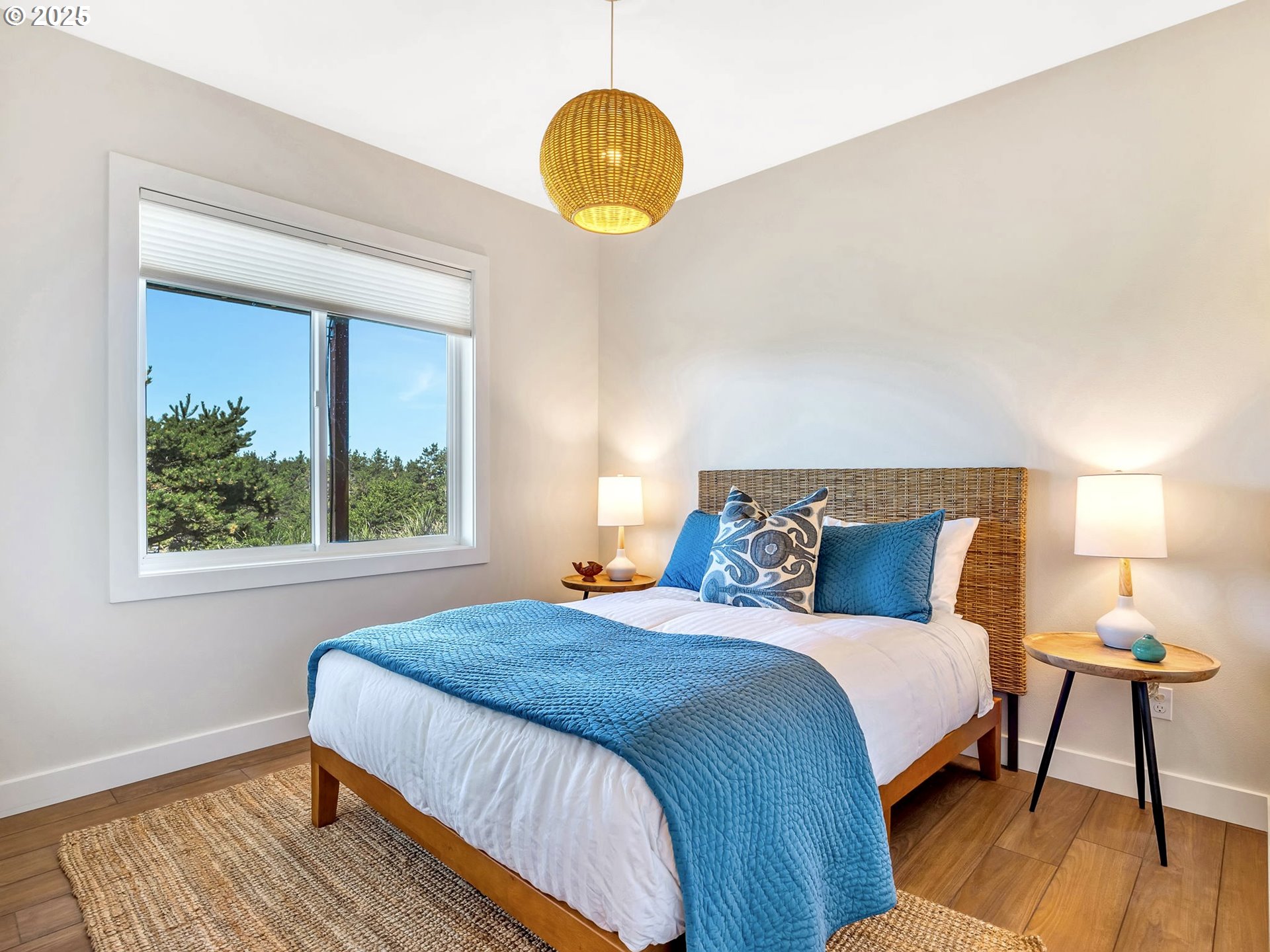 90043 Ocean Drive Warrenton, OR 97146 - Photo 34 of 48 a bedroom with a bed a window and potted plant