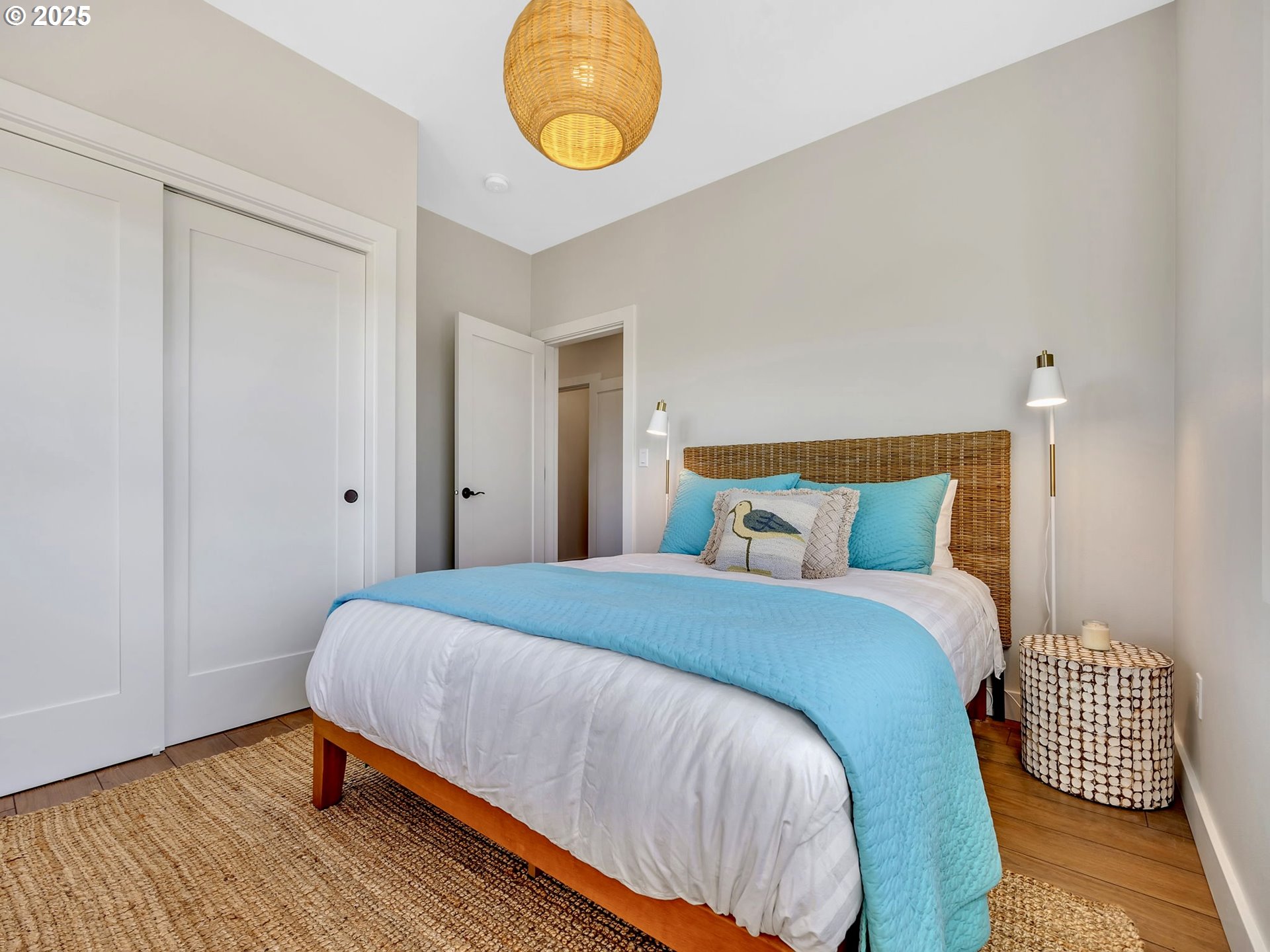 90043 Ocean Drive Warrenton, OR 97146 - Photo 39 of 48 a bedroom with a bed and wooden floor