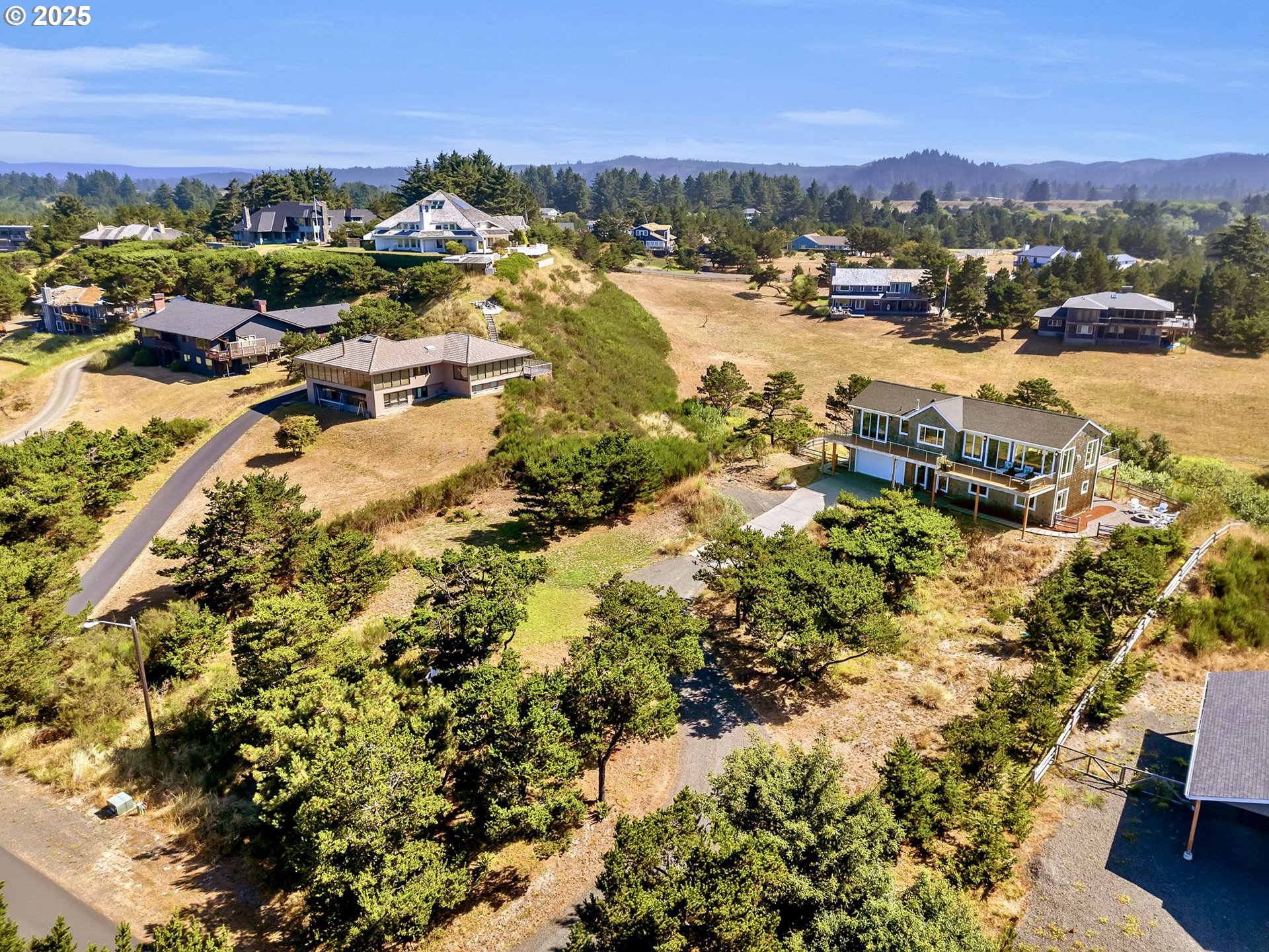 90043 Ocean Drive Warrenton, OR 97146 - Photo 41 of 48 a view of a lake with mountains in the background