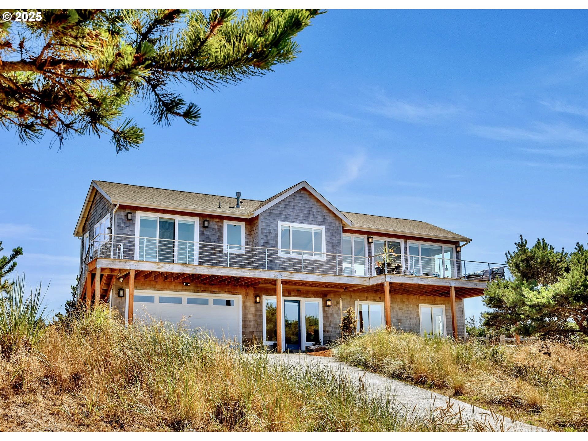 90043 Ocean Drive Warrenton, OR 97146 - Photo 5 of 48 a front view of a house with a garden