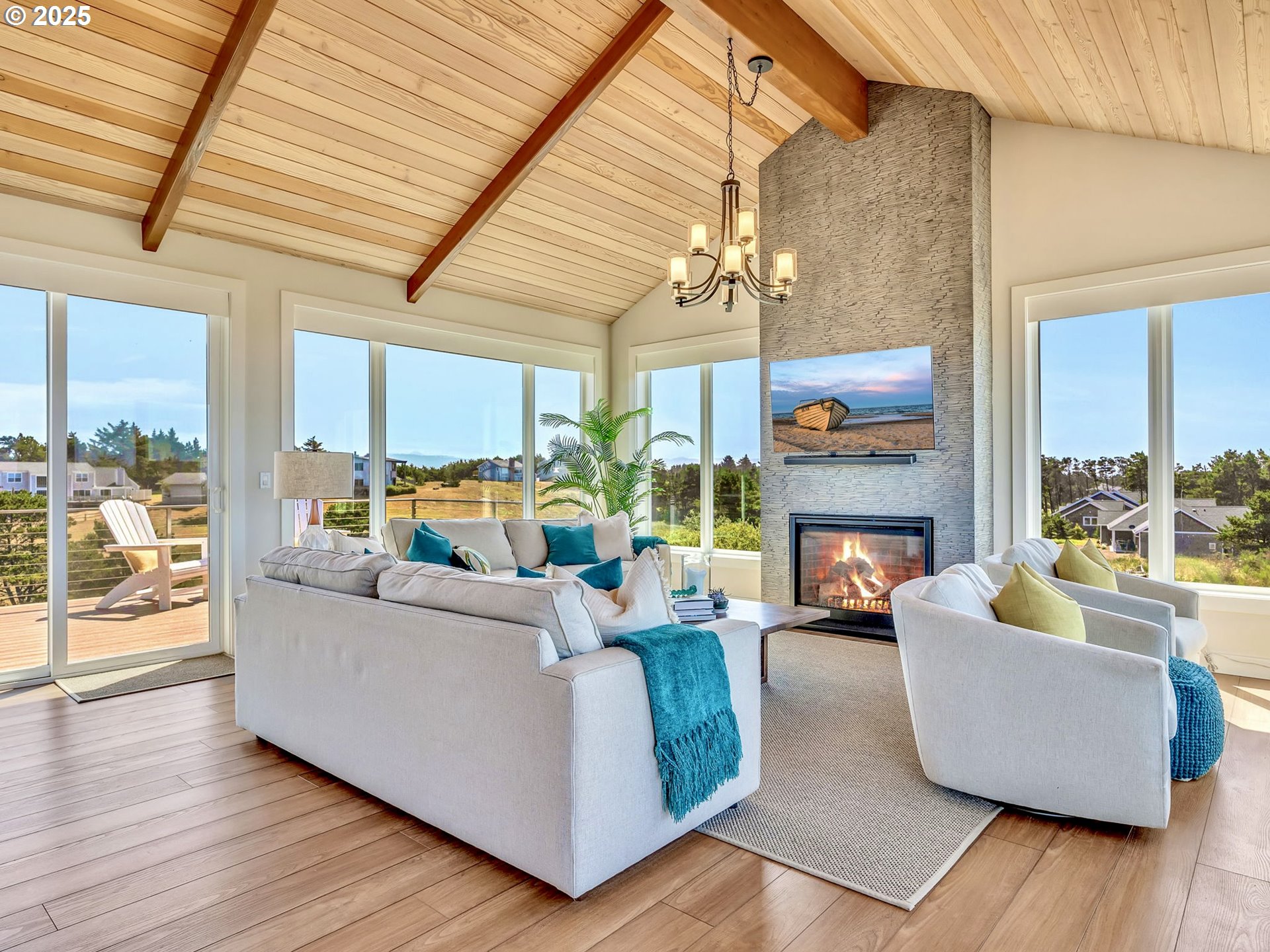 90043 Ocean Drive Warrenton, OR 97146 - Photo 8 of 48 a living room with fireplace furniture and a large window