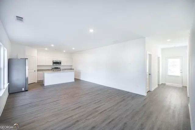 a bathroom with a toilet and a mirror