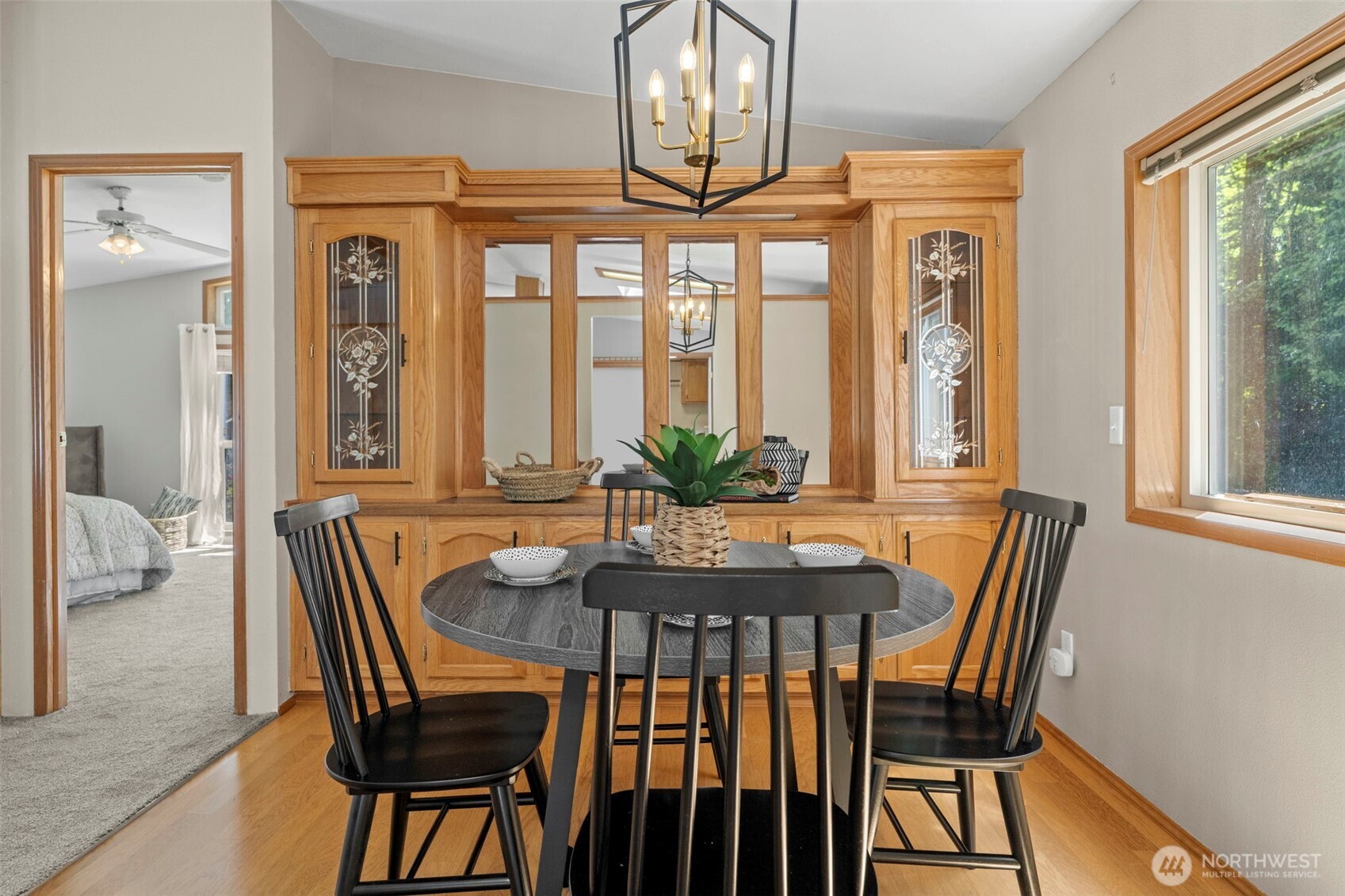 3758 Aiken Road Southeast Port Orchard, WA 98366 - Photo 12 of 40 a view of a dining room with furniture window and wooden floor