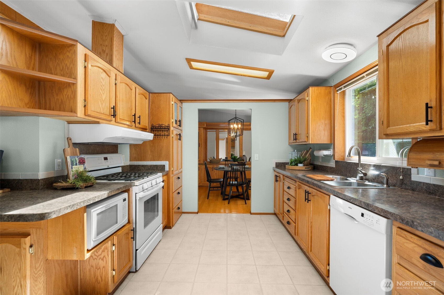 3758 Aiken Road Southeast Port Orchard, WA 98366 - Photo 13 of 40 a kitchen with stainless steel appliances granite countertop a stove and a sink