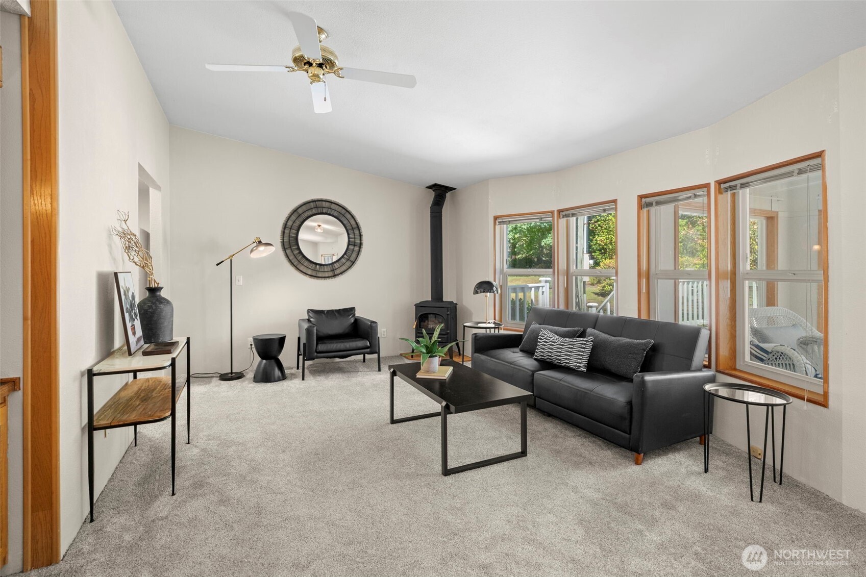 3758 Aiken Road Southeast Port Orchard, WA 98366 - Photo 16 of 40 a living room with furniture a fireplace and a window