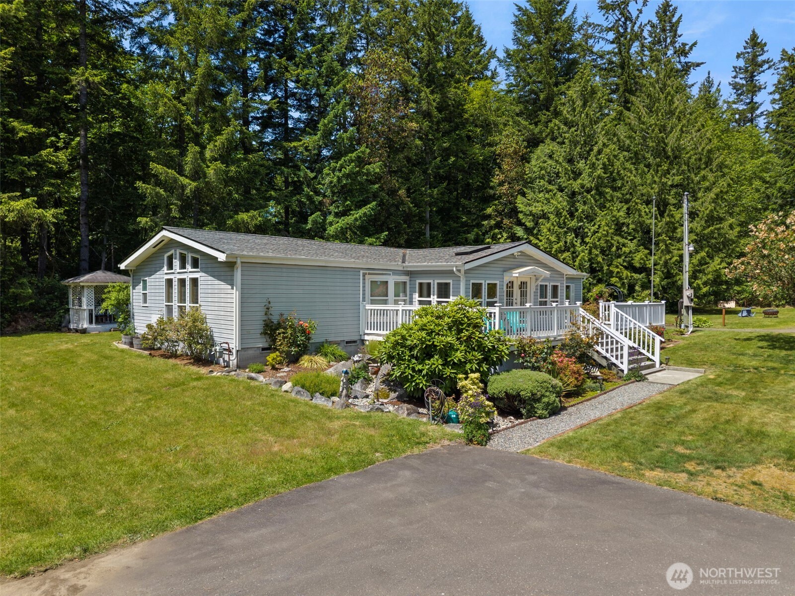3758 Aiken Road Southeast Port Orchard, WA 98366 - Photo 2 of 40 a front view of house with yard and green space