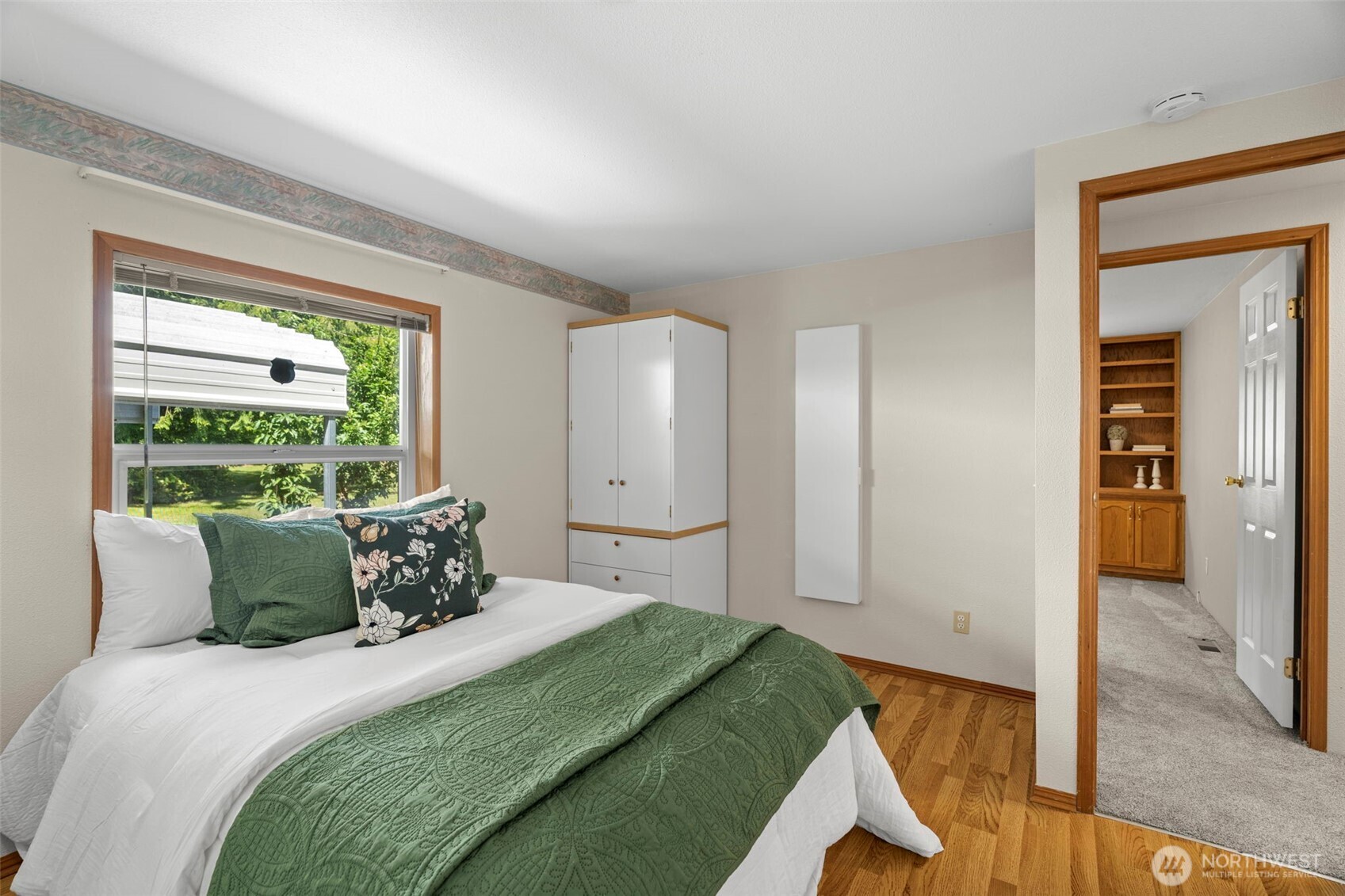 3758 Aiken Road Southeast Port Orchard, WA 98366 - Photo 23 of 40 a bedroom with a bed and large mirror