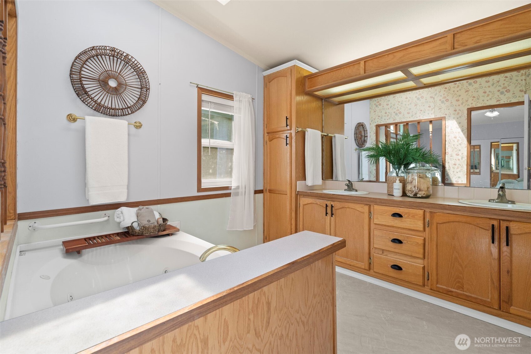 3758 Aiken Road Southeast Port Orchard, WA 98366 - Photo 24 of 40 a bathroom with a granite countertop sink and a mirror