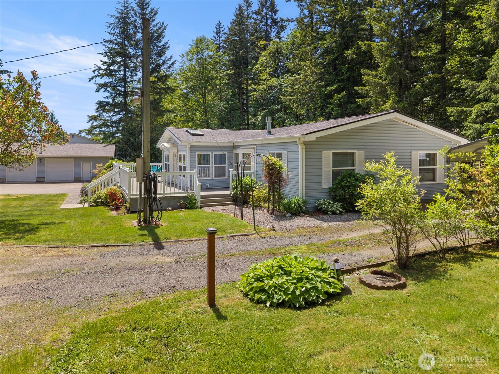 3758 Aiken Road Southeast Port Orchard, WA 98366 - Photo 3 of 40 a view of a house with a yard and pathway