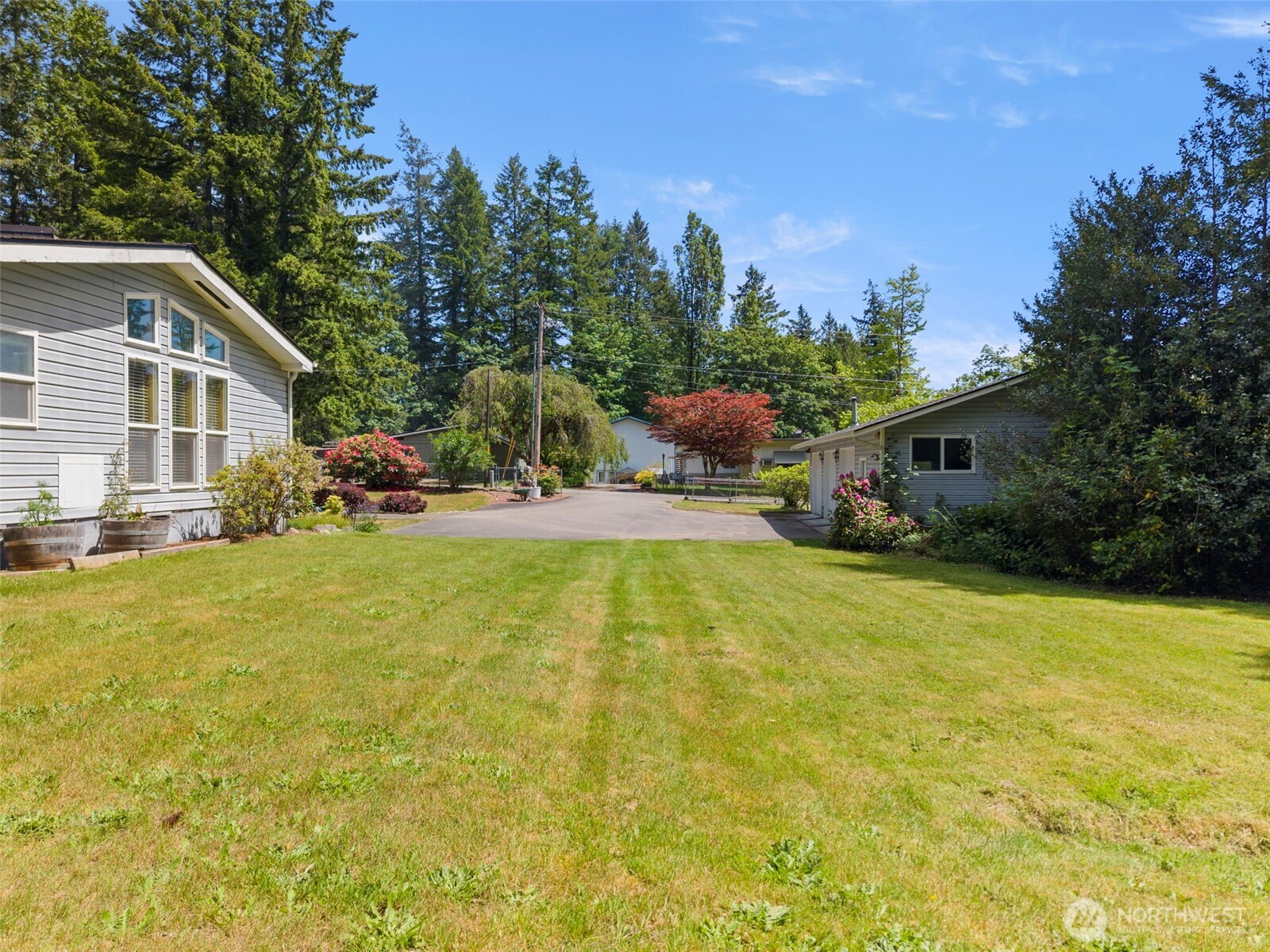 3758 Aiken Road Southeast Port Orchard, WA 98366 - Photo 32 of 40 a swimming pool with outdoor seating and yard