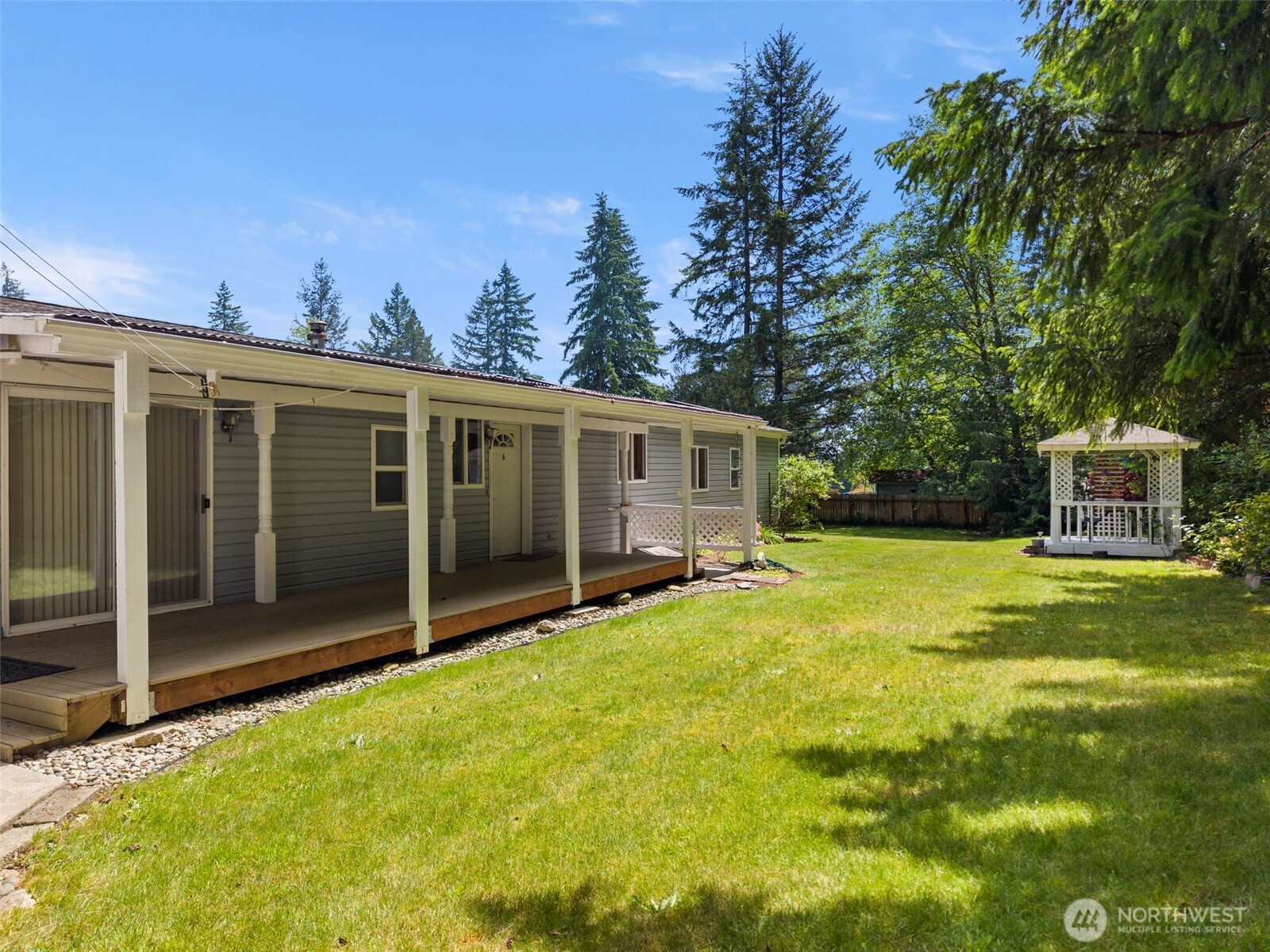 3758 Aiken Road Southeast Port Orchard, WA 98366 - Photo 33 of 40 a view of a house with a yard and a tree