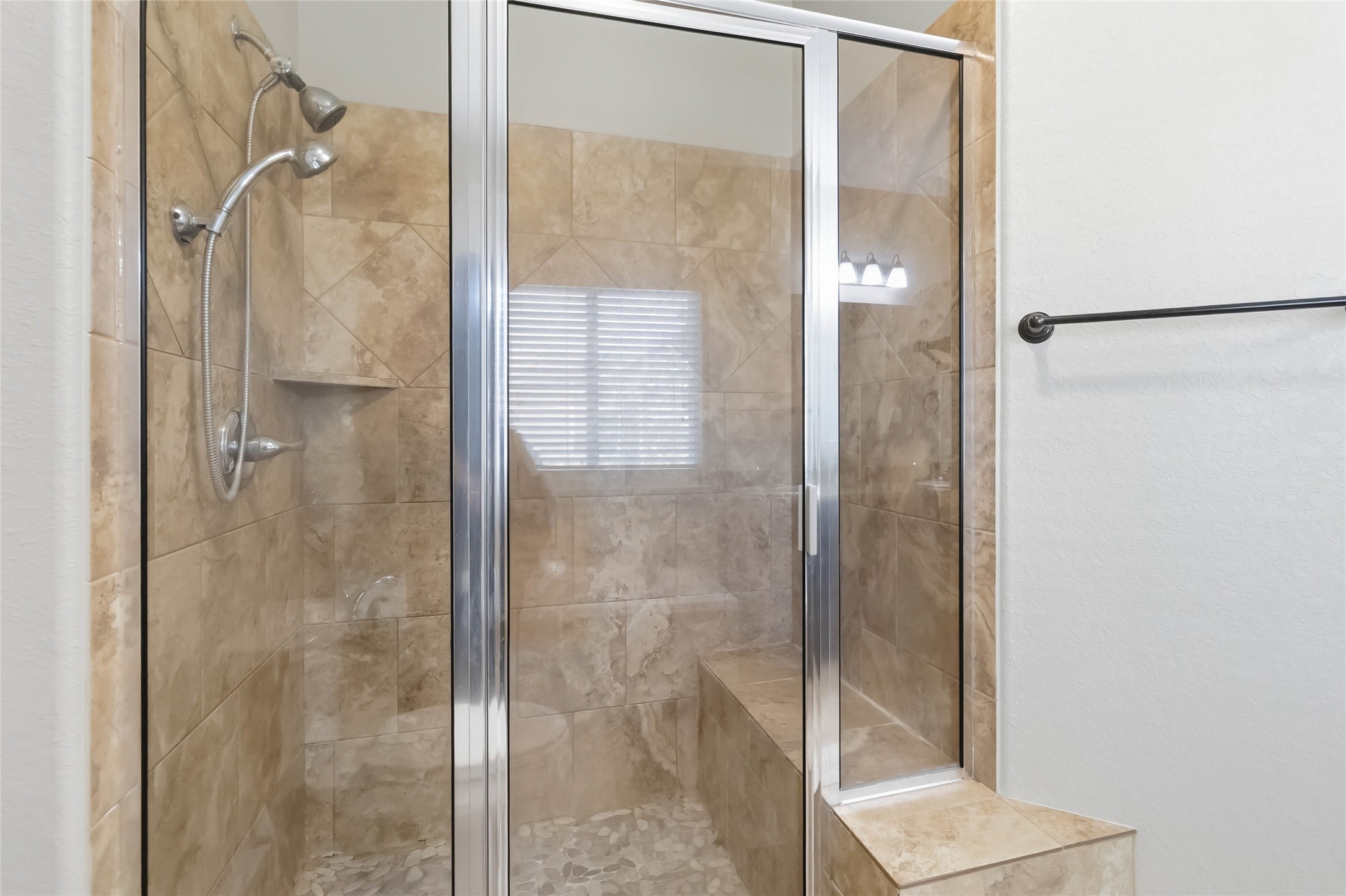 285 Hummingbird Way Martindale, TX 78655 - Photo 23 of 40 a bathroom with a glass shower door