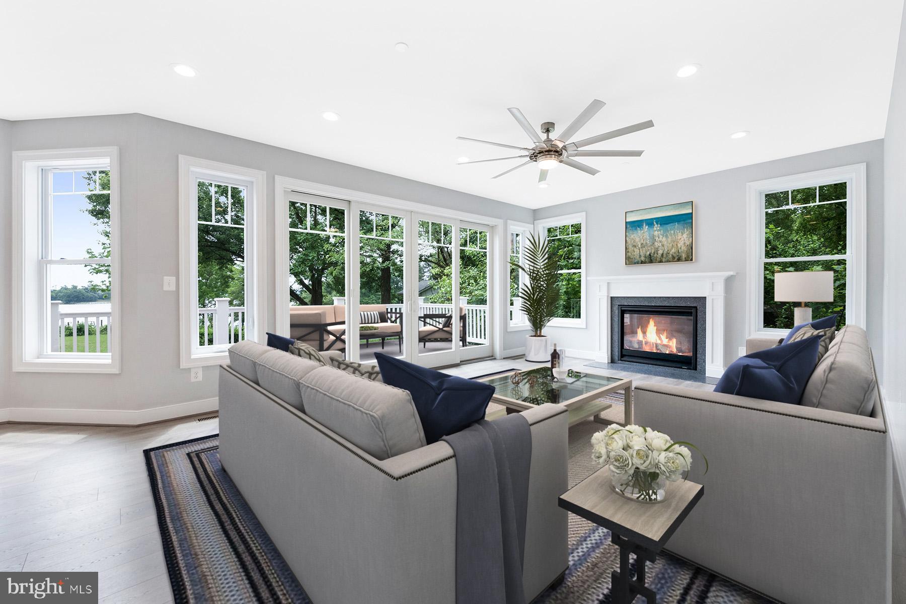 Great room has wall of windows and gas fireplace