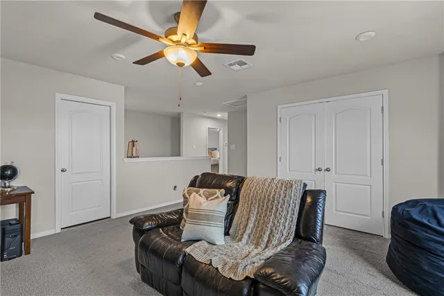 a view of livingroom with furniture and a ceiling fan