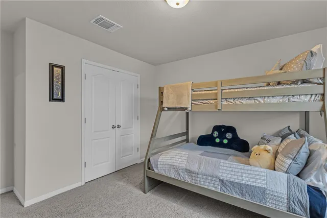 a bedroom with a bed and closet