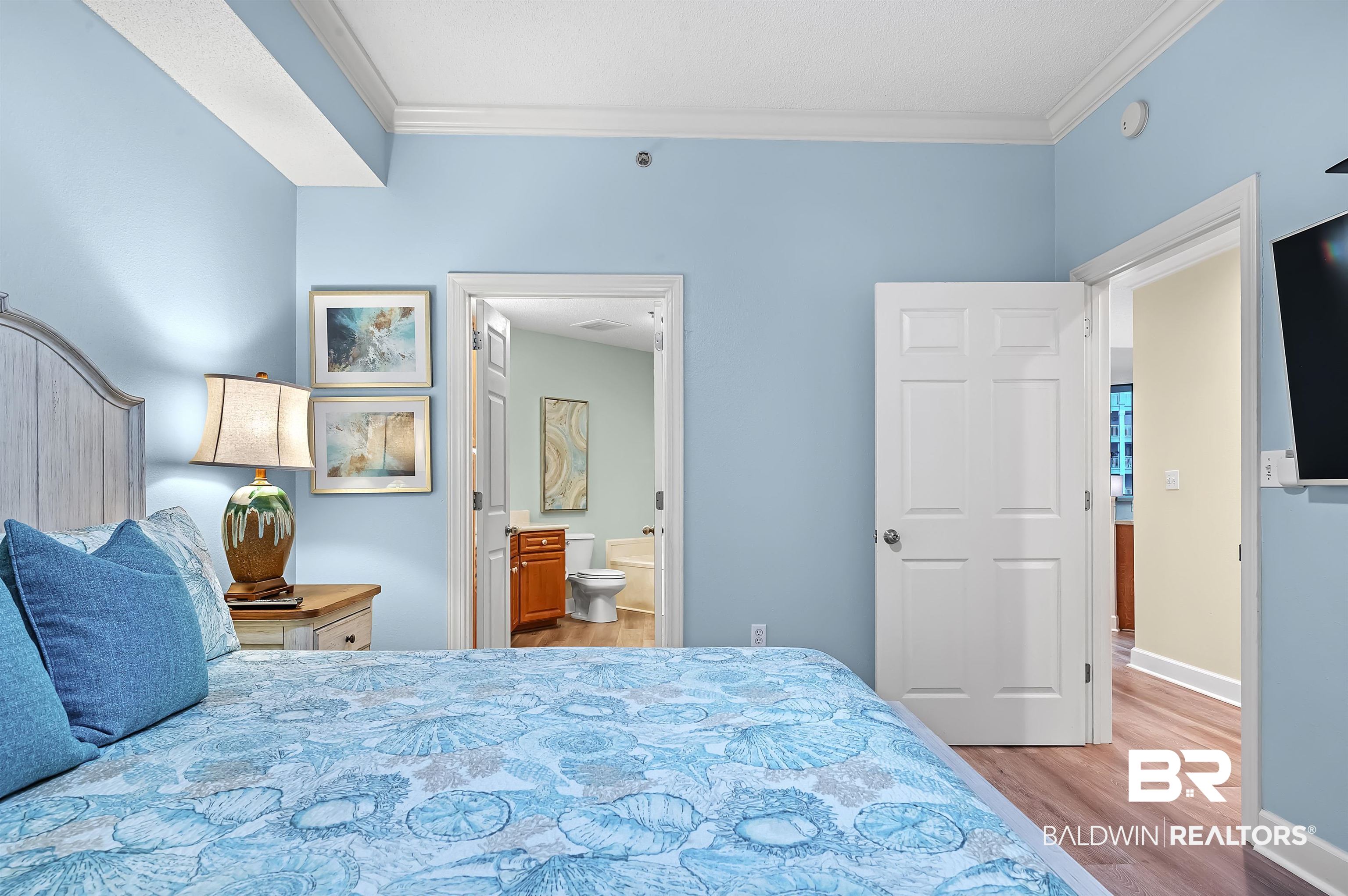 27582 Canal Road, Unit 2104 Orange Beach, AL 36561 - Photo 21 of 35 Bedroom with light hardwood / wood-style floors, ornamental molding, and ensuite bathroom