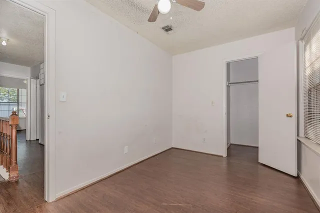 an empty room with a empty space and windows