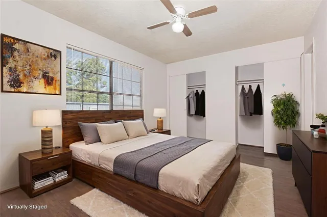 a bedroom with a large bed and a window