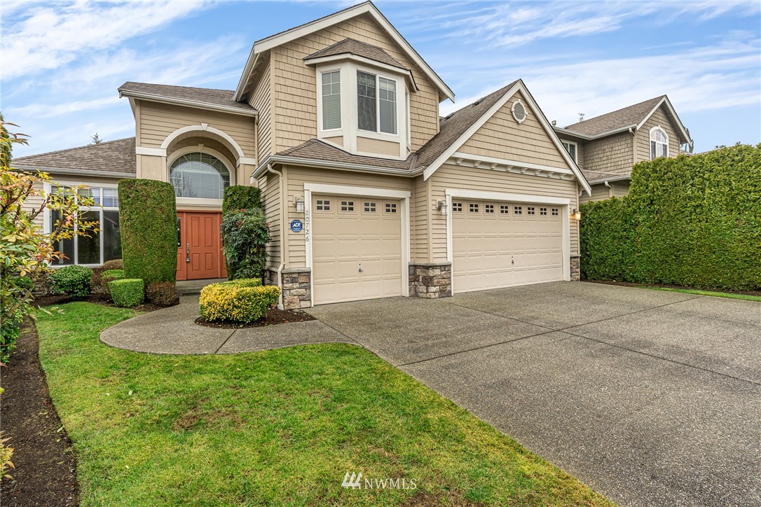 20726 37th Drive Southeast Bothell, WA 98021 - Photo 1 of 1 a front view of a house with a yard and garage
