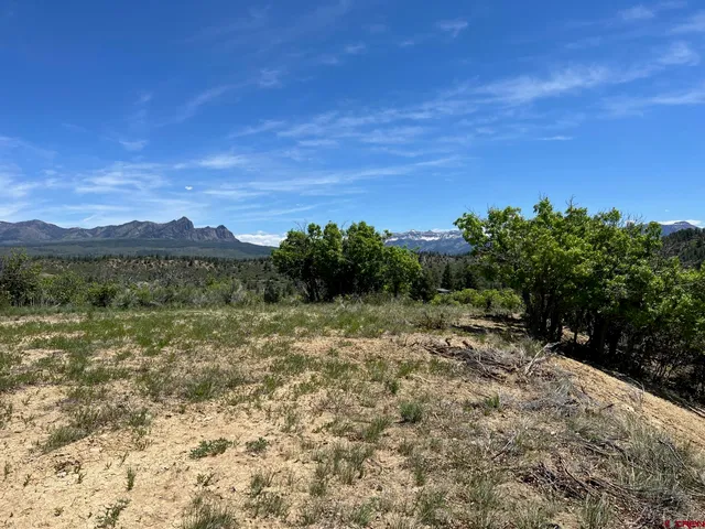 a view of a lake with mountains in the background