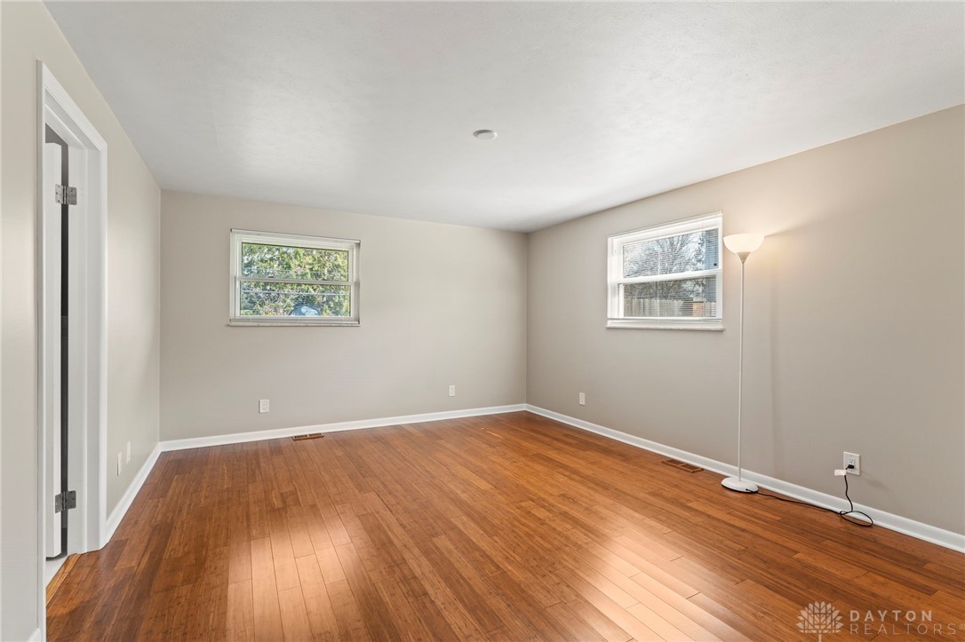 2247 East Whipp Road Dayton, OH 45440 - Photo 25 of 52 This airy room features rich hardwood flooring and abundant natural light through multiple windows.