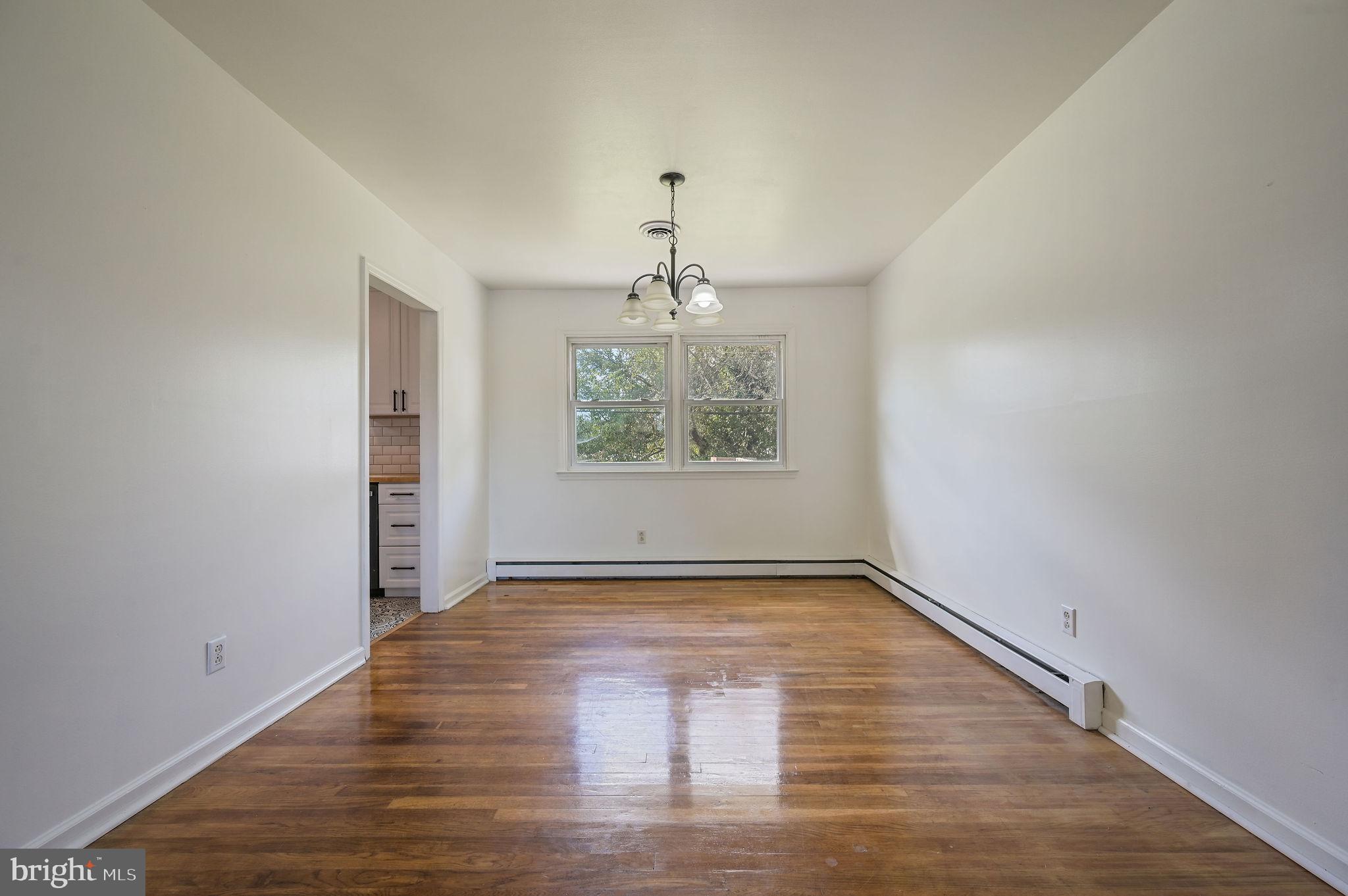 908 South Cass Street Middletown, DE 19709 - Photo 11 of 28 wooden floor in an empty room with a window