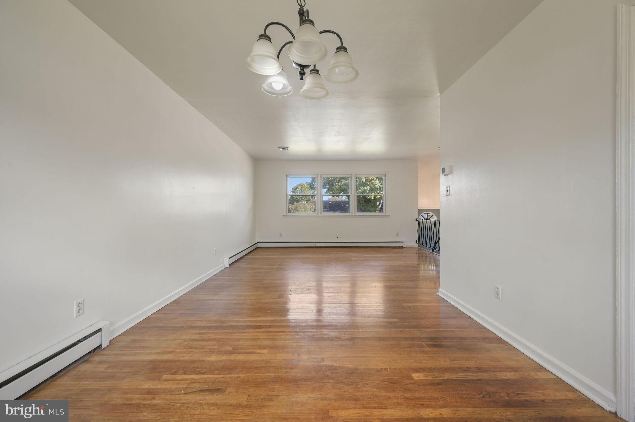 908 South Cass Street Middletown, DE 19709 - Photo 12 of 28 a view of empty room with wooden floor