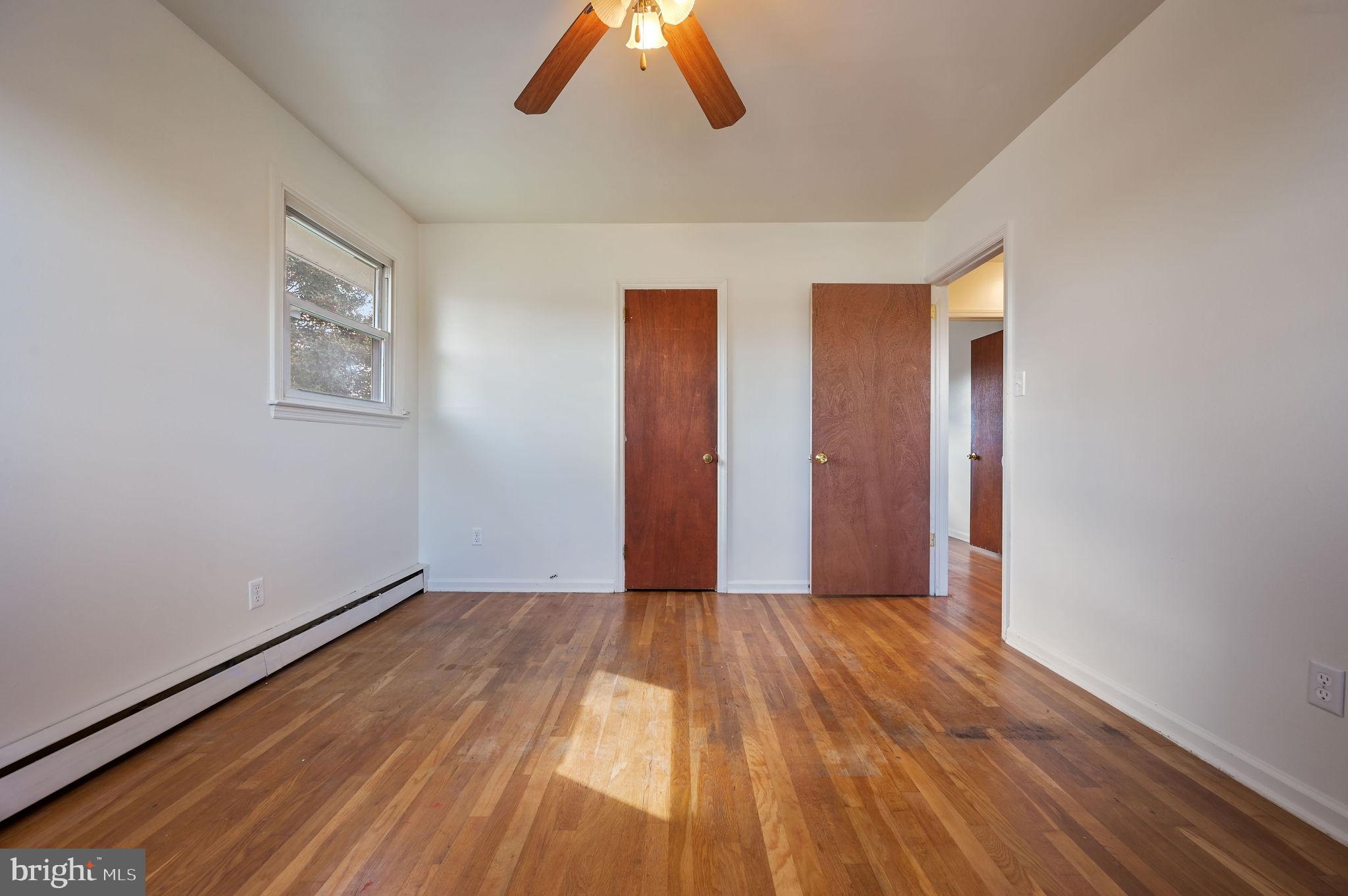 908 South Cass Street Middletown, DE 19709 - Photo 22 of 28 a view of an empty room with wooden floor
