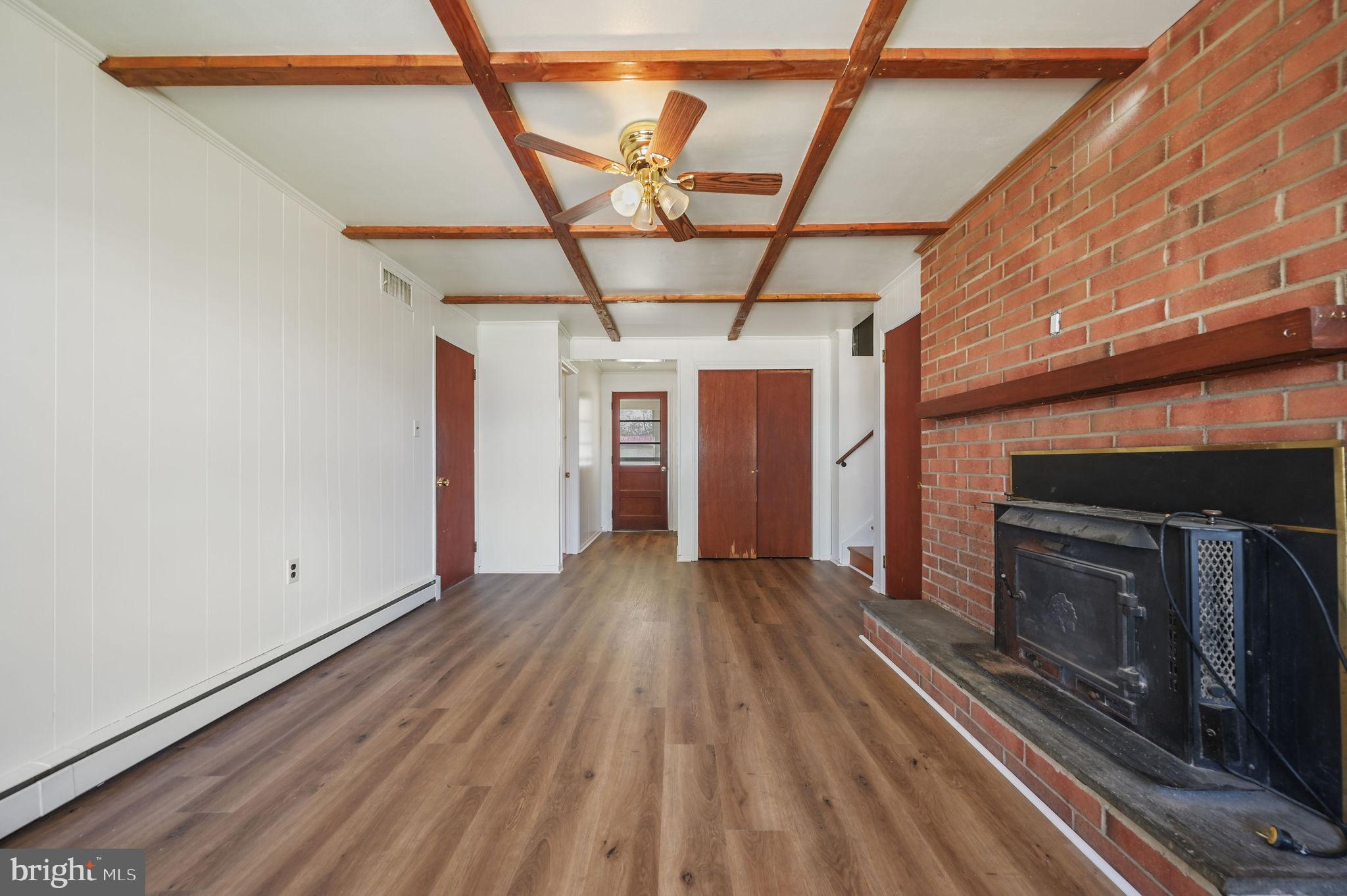 908 South Cass Street Middletown, DE 19709 - Photo 23 of 28 a view of empty room with wooden floor and fireplace
