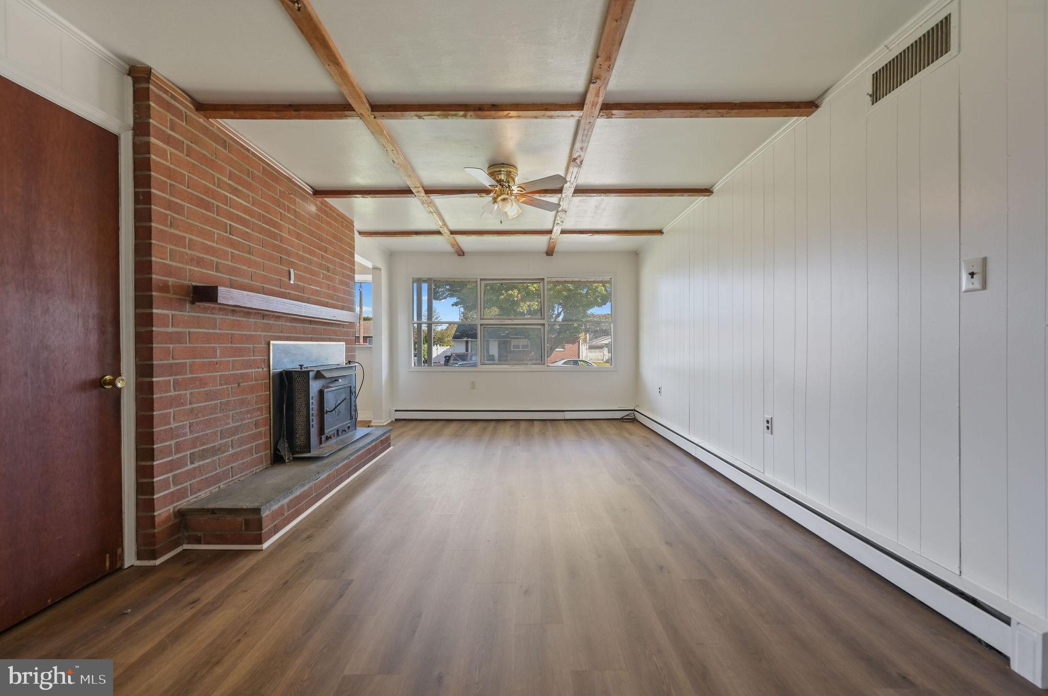 908 South Cass Street Middletown, DE 19709 - Photo 25 of 28 a view of an empty room with a fireplace and a window