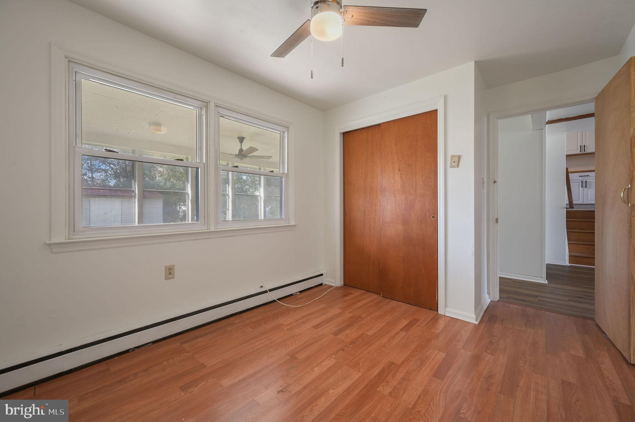 908 South Cass Street Middletown, DE 19709 - Photo 27 of 28 a view of empty room with wooden floor and fan
