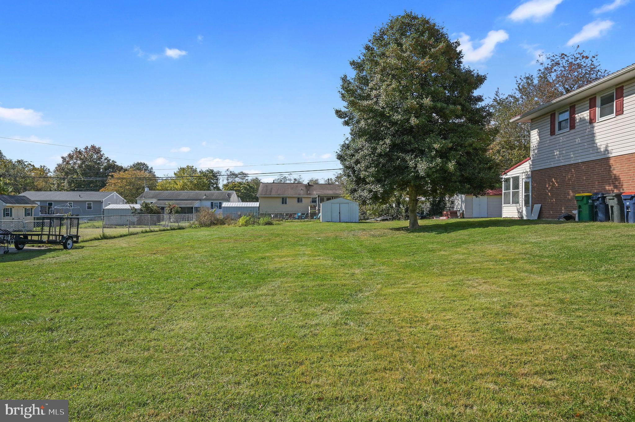 908 South Cass Street Middletown, DE 19709 - Photo 3 of 28 a view of a green field with house in the background
