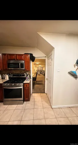 a view of kitchen with furniture and window