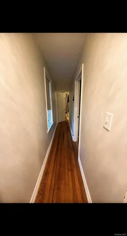 a bedroom with a bed and a view of kitchen