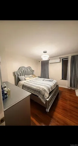 a bedroom with a bed and a view of bedroom