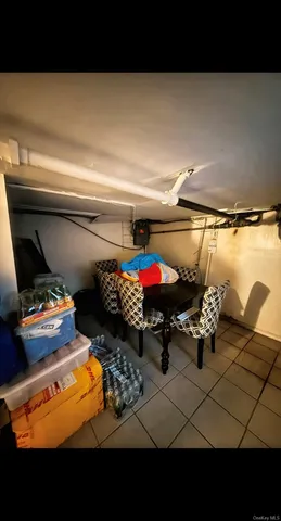 a bedroom with a bed and a flat tv screen