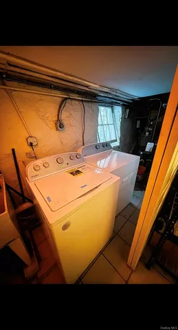a view of a balcony with wooden floor and a ocean view
