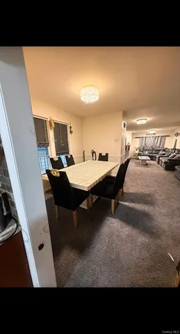 a upper view of a living room and dining room