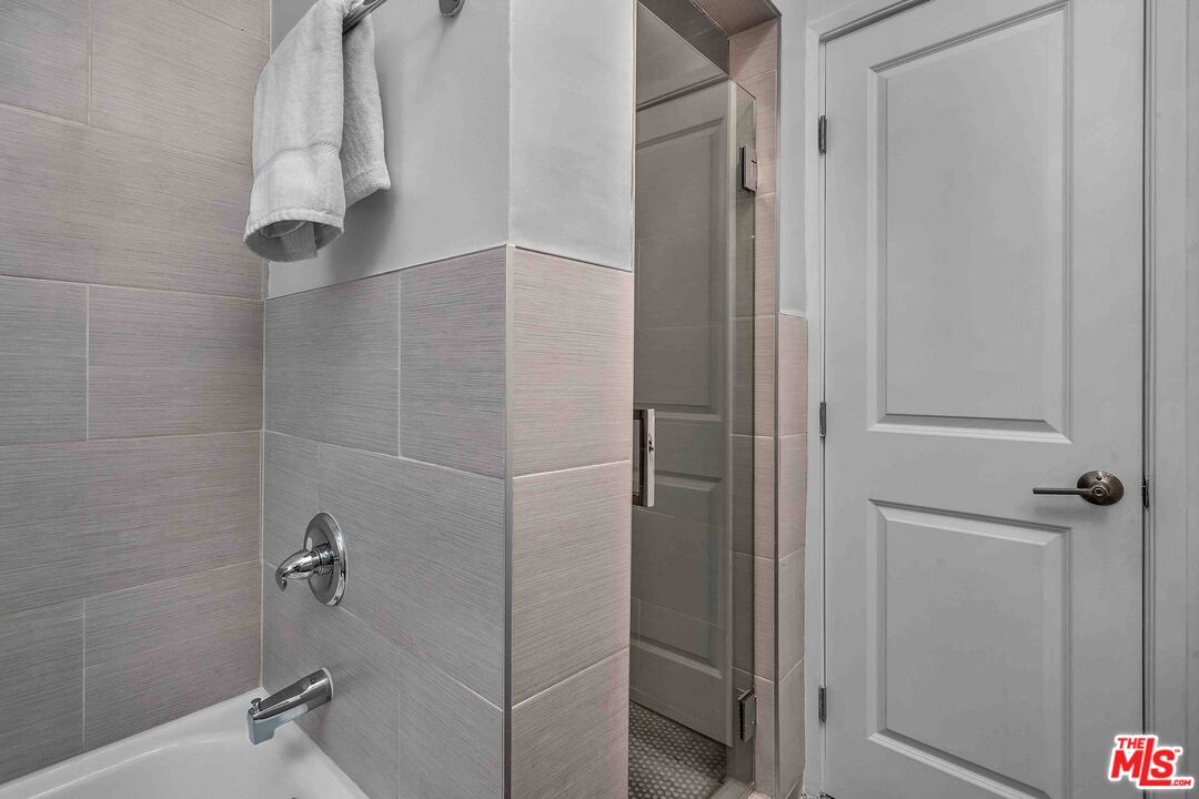 11575 Riverside Drive Valley Village, CA 91602 - Photo 12 of 16 a bathroom with a shower