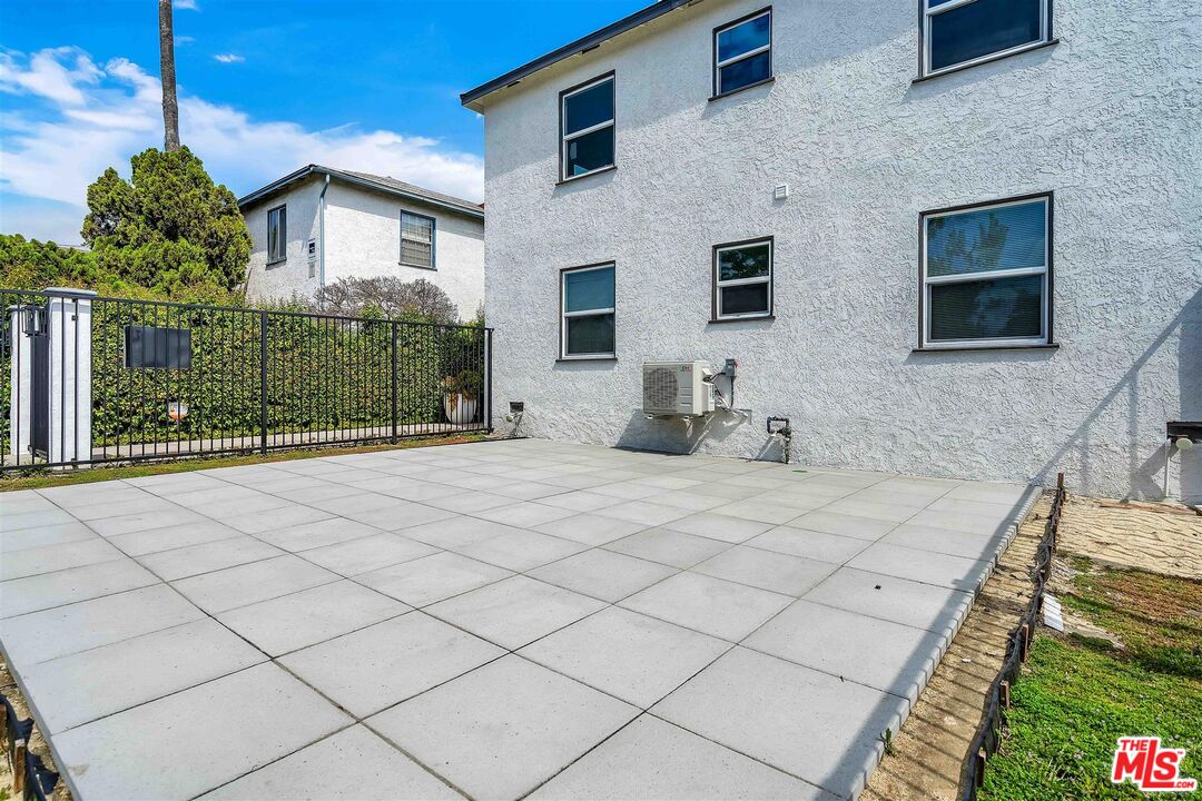 11575 Riverside Drive Valley Village, CA 91602 - Photo 16 of 16 a view of a house with backyard and sitting area