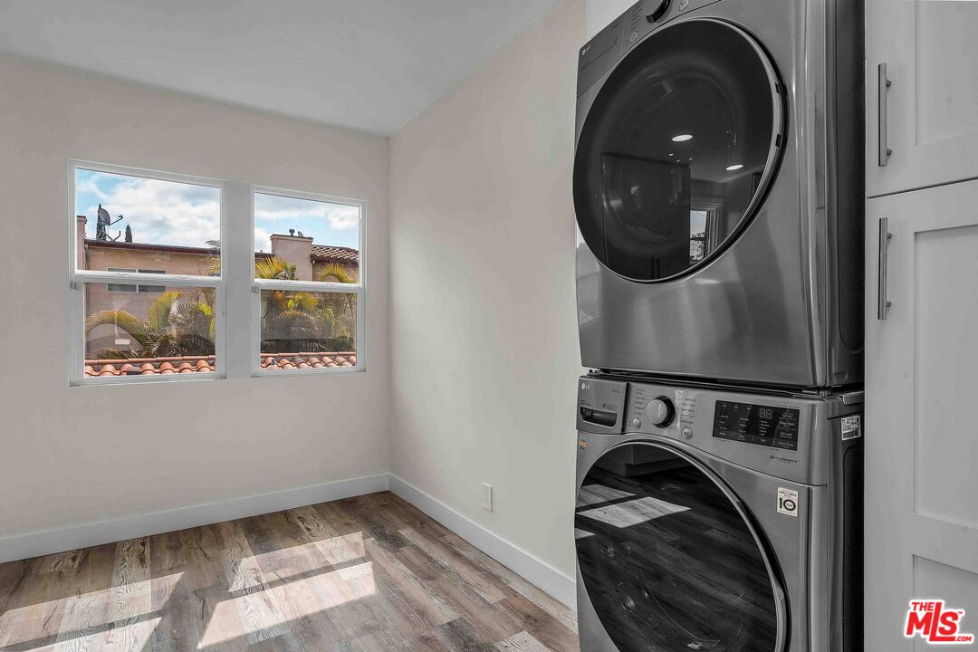 11575 Riverside Drive Valley Village, CA 91602 - Photo 8 of 16 a view of a storage and utility room with washer and dryer