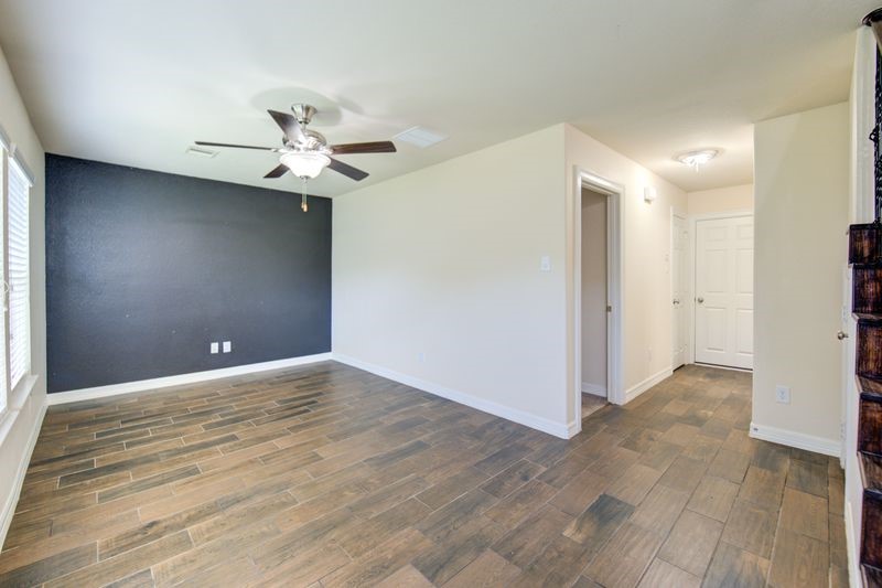 10014 Spring Shadows Park Circle Houston, TX 77080 - Photo 30 of 39 a view of an empty room and a ceiling fan window