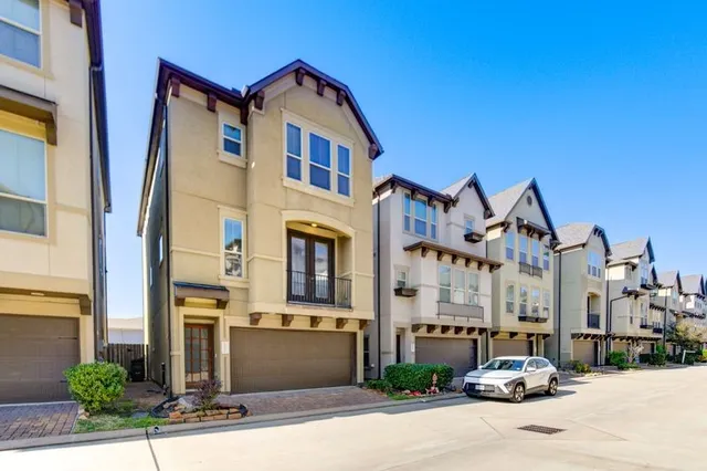 a city street lined with buildings and cars