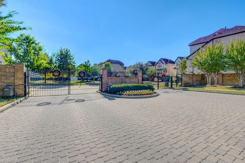 10014 Spring Shadows Park Circle Houston, TX 77080 - Photo 39 of 39 a view of swimming pool with a yard and a fountain